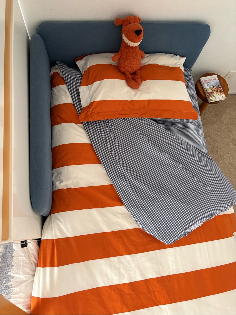 Pottery Barn Kids Orange and White Duvet cover and Navy blue gingham set.